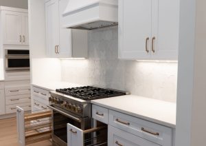 White and Blue Shaker Cabinets With Pullouts